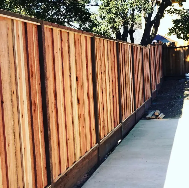 New redwood privacy fence along a side yard